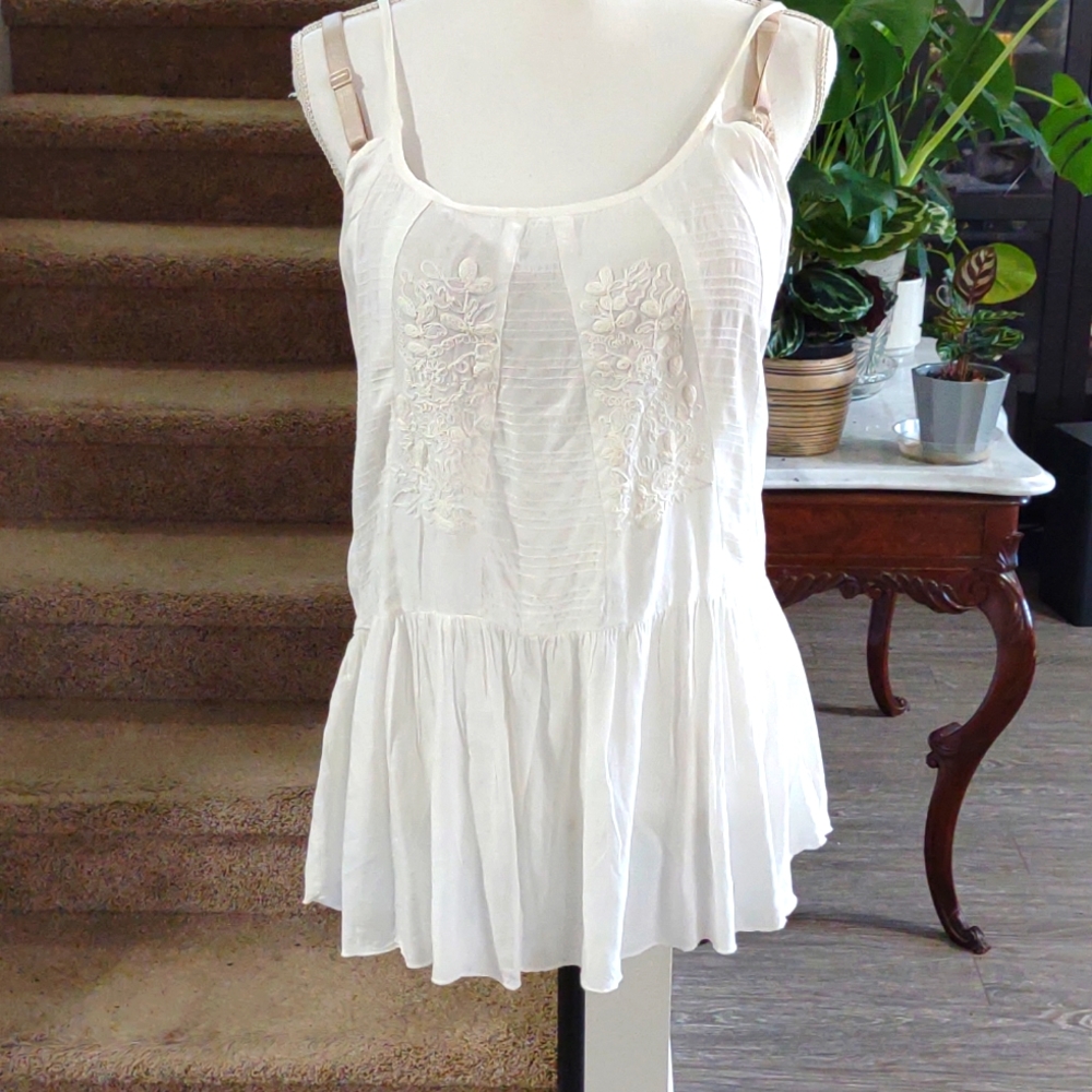 White embroidered spaghetti strap top.